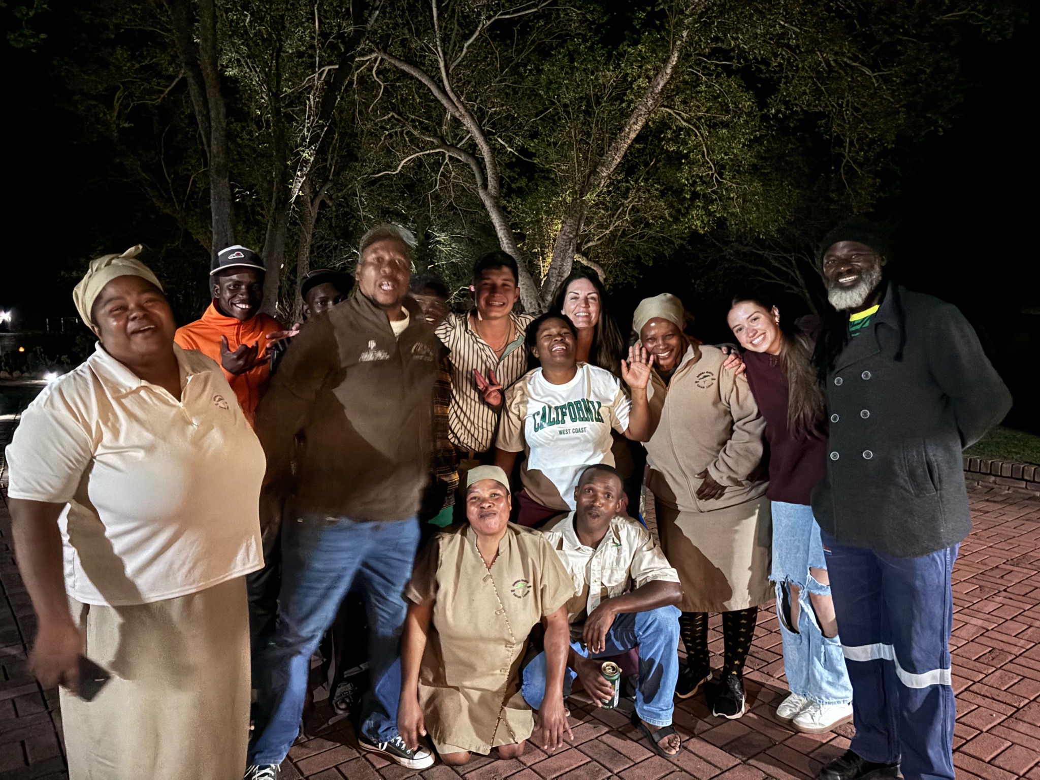 Seringa team members and students celebrating together at the lodge