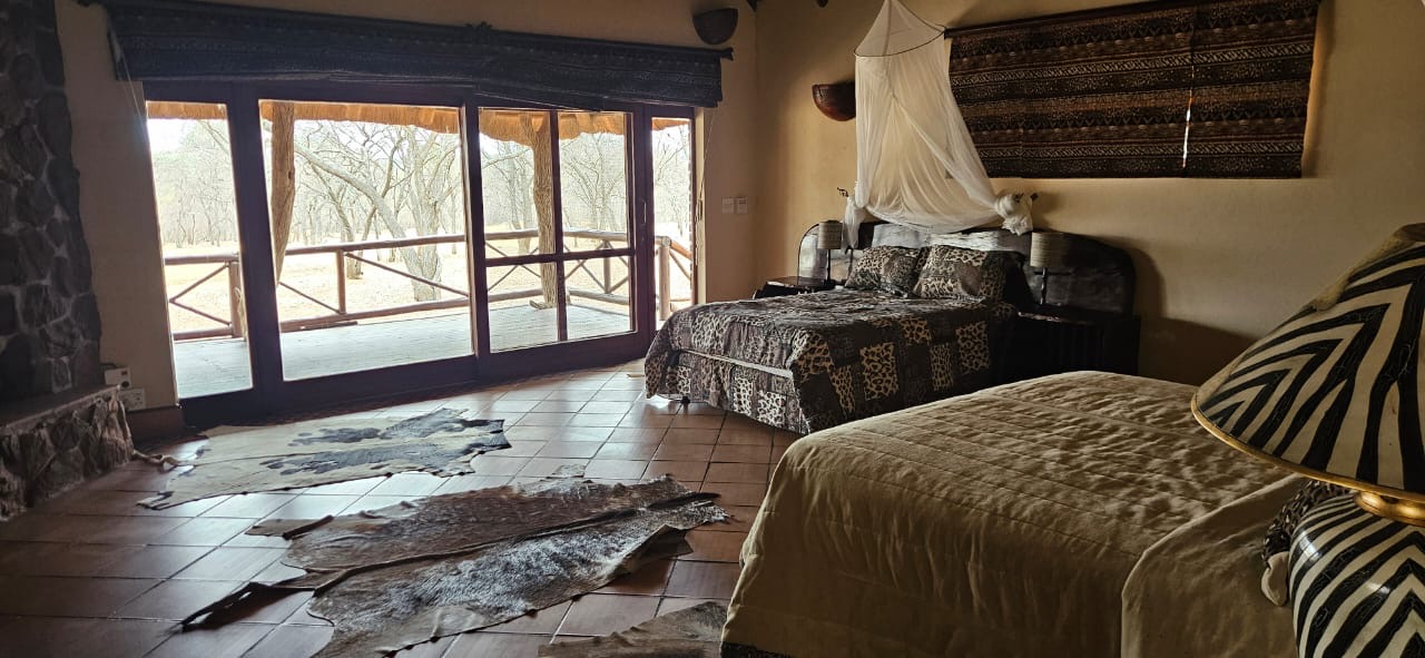 Spacious chalet bedroom opening onto a private veranda