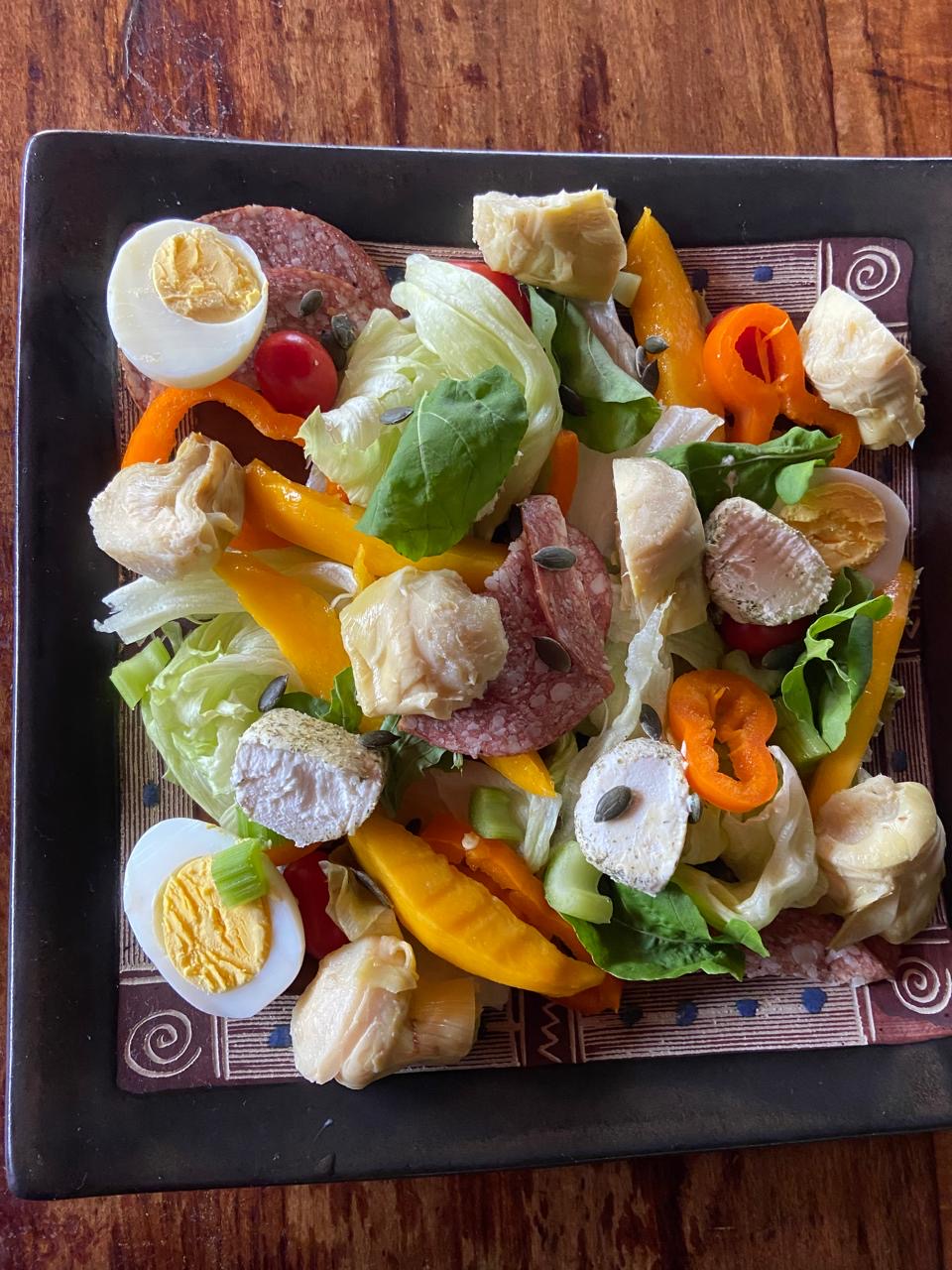 Colorful salad with avocado, eggs and fresh vegetables